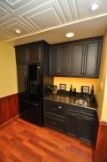 The elegant black wet bar cabinets with new refrigerator