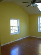 New bedroom interior completed with new flooring, skylights and ceiling fan