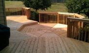 This octagonal step down deck space is the centerpiece of this spectacular deck