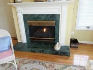 The fireplace before Drumm Remodeling was a standard builder grade fireplace with little impact