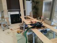 Cabinet frames and base trim being put together on table