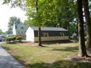 This garage features a stylish Gambrell roof