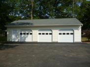 The finished garage paved front view