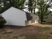 View of garage from side and back with finished Gambrell roof