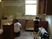 Kitchen cabinets being installed by the Drumm Design Remodel team