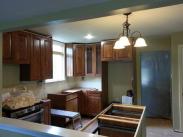 Kitchen cabinets beinf installed by Drumm Design Remodel