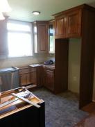 Kitchen cabinets being installed