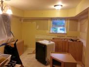 Removing old cabinets and appliances before remodeling by Drumm Design Remodel