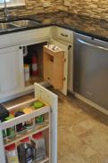 Another view of the spice rack and under sink storage