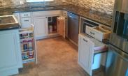 Multiple places for clever and convenient storage in this kitchen help the homeowner maximize their space