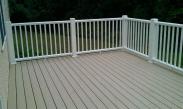 A beautiful deck with a sturdy railing system by Drumm Design Remodel