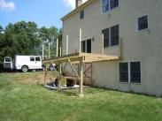 Drumm Design Remodel poured new silo footings and a patio before framing of this deck began