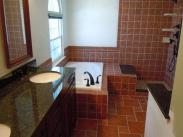 New granite counter tops, and decorative tile throughout this redesigned bathroom