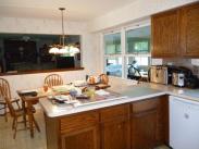 The L-Shaped counter was removed by Drumm Design Remodel in favor of a center island