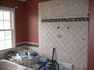 The new tile being installed and ready for grouting