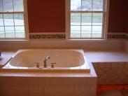 New tile around the soaking tub matches the new design