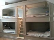 This bunkroom needed more storage space and upgraded lighting fixtures