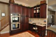 A built-in double oven and corner office space really upgraded this roomy new kitchen by Drumm Design Remodel