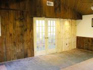 Drumm Design Remodel installed new french doors and replaced old rotted wood paneling in this addition