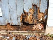 Water damage caused this sil and paneling to rot away, making the room structurally unsound