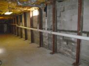 After the gaps between the steel beams and walls were filled with concrete by Drumm Design Remodel