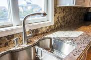 Drumm Design Remodel added contoured, undermounted double sink with a built in sprayer feature in the faucet to this custom kitchen